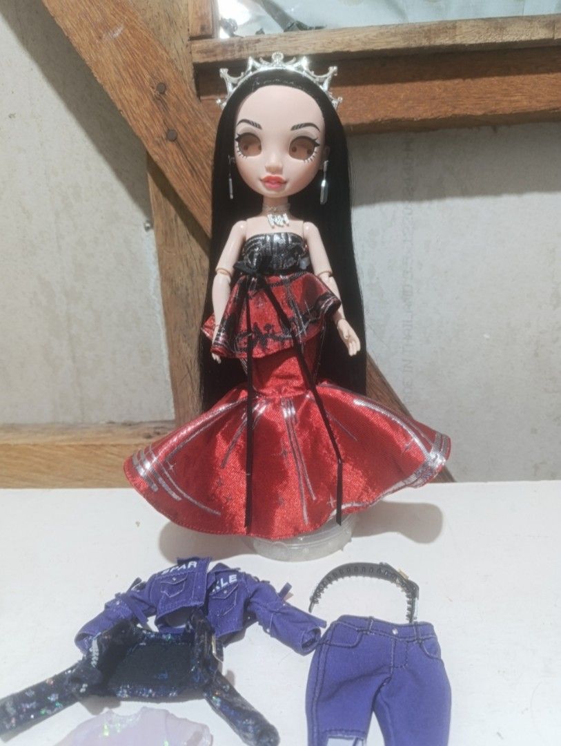 Rainbow High Jett Set (Category: Kids Toys) located in Iloilo. Submitted by chronozneon (Listing ID 1468356802, Image 1). Description: - Fully articulated fashion doll with gorgeous long black hair - Dressed in a stunning red formal gown with matching crown, earrings, and necklace - Includes a bonus stylish purple denim jacket and matching purple pants - Great for both serious doll collectors and imaginative play.