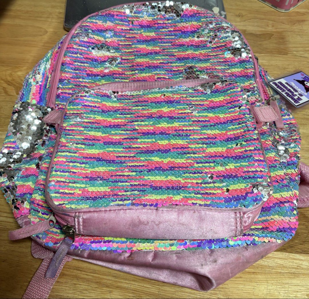 Rainbow Sequin Backpack (sequins intact) (Category: Babies & Kids Fashion) located in Marikina City. Submitted by thrifty_trinkets_by_anais (Listing ID 1468331271, Image 1). Description: 🌸 Selling own preloved/brand new items for less - EVERYTHING is negotiable as long as REASONABLE in price 🤗 🎒 needs cleaning 🎒 signs of usage 🎒 sequins are complete 🙏🏻 Please also check my account for more marked down items 🫶 📍Marikina near S&R/Uniqlo 💳