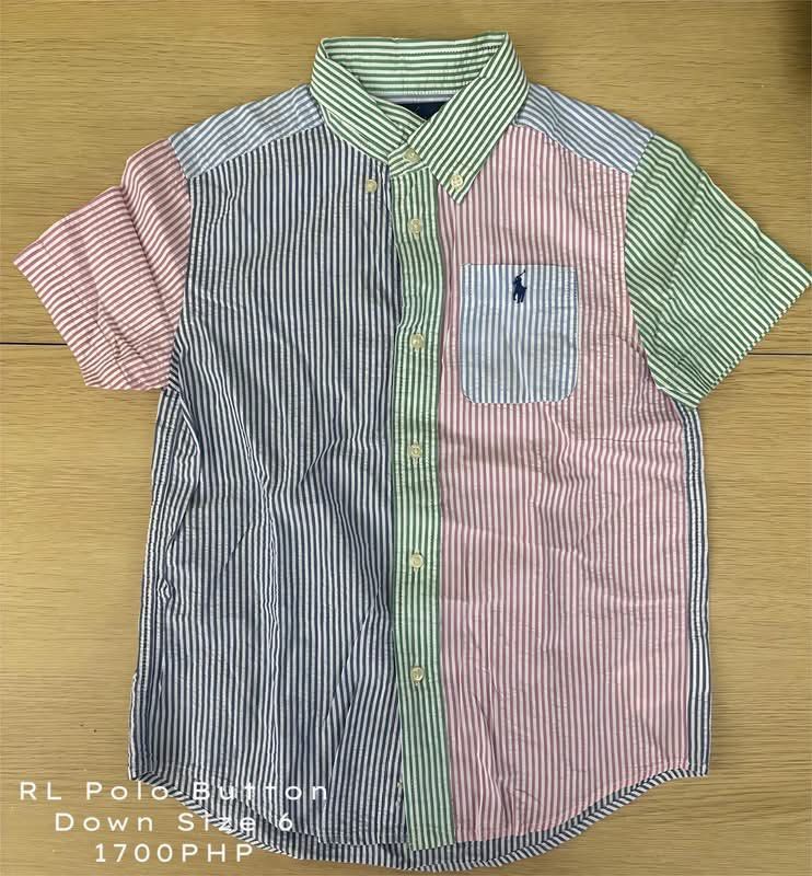 Ralph Lauren Polo Button Down Size 6 (Category: Babies & Kids Fashion) located in Calamba. Submitted by firstlovedboutique_ph (Listing ID 1468328589, Image 1). Description: - Brand: Ralph Lauren - Size: Boys Size 6 - Design: Multicolor patchwork stripe pattern (blue, pink, green, white) - Details: Classic collar, front chest pocket with signature embroidered pony logo, standard button-down closure - Style: Short sleeve, smart-casual.