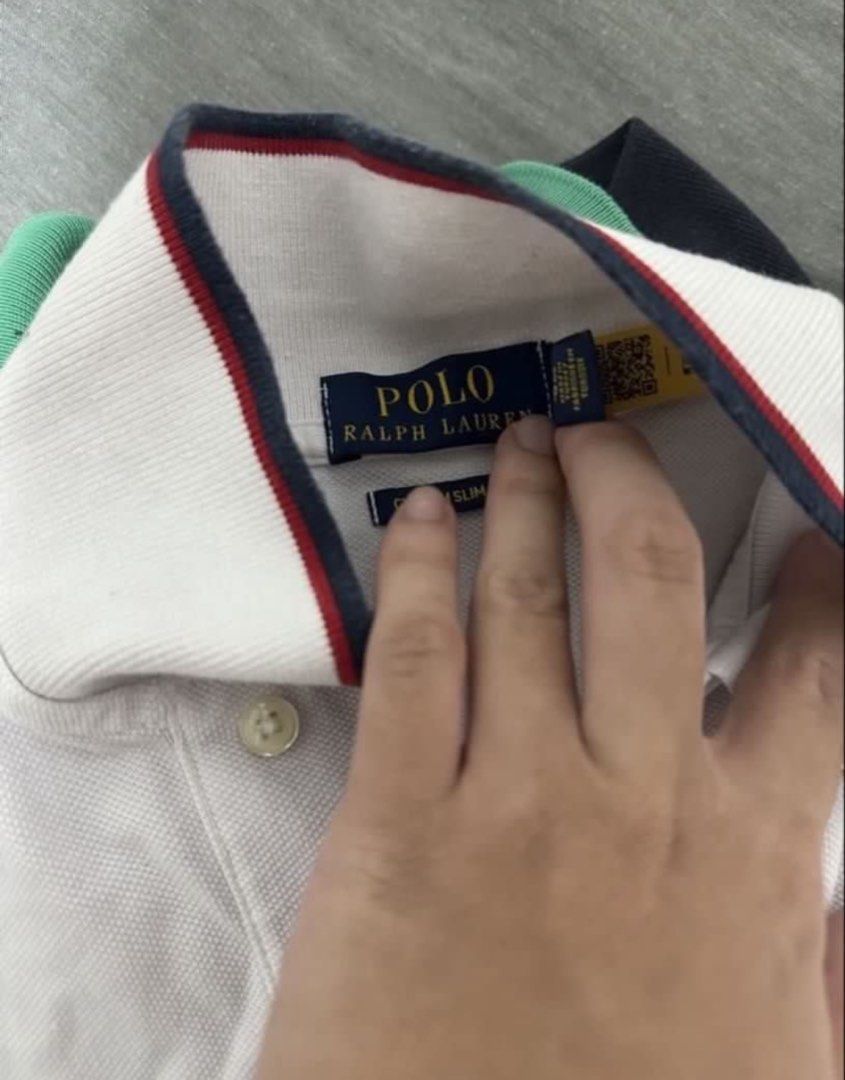 Ralph Lauren Polo Shirt (Category: Tshirts & Polo Shirts ) located in Subic. Submitted by declutterbyshit (Listing ID 1468370528, Image 3). Description: - Brand: Polo Ralph Lauren (27x18) - Color: White mesh with red and navy tipping on collar and cuffs - Fit: Custom Slim Fit - Details: Blue embroidered pony logo on chest, two-button placket with white buttons, navy inner collar tag - Condition: Excellent pre-loved / Brand new (as applicable) - S