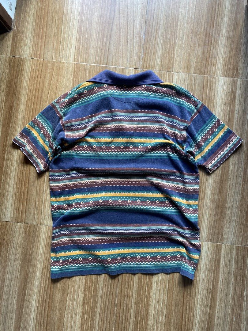 Random Aztec Pattern Polo Shirt (Category: Tshirts & Polo Shirts ) located in Caloocan City. Submitted by jumongneedsrags (Listing ID 1468421862, Image 2). Description: Pit to pit: 22 in Shoulder to shoulder: 20 in Length: 29 in Issues: Great distression on left sleeve Very Negotiable Price.