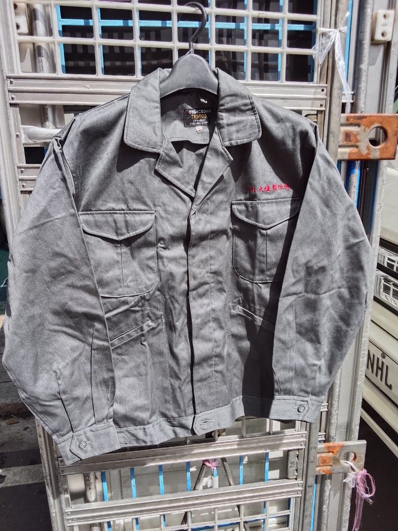 Rare 1970s kuraray Japanese twill Cinch work jacket (Category: Coats, Jackets and Outerwear) located in Manila. Submitted by newage.vintage (Listing ID 1468303087, Image 1). Description: - Style: Japanese work jacket/ Chore coat/ utility outerwear - Color:Charcoal / steel grey - size: Large on tag - materials:50% vinylon / 50% cotton (twill blend) - red embroidered Japanese text above chest pocket - side waist adjuster straps with metal buckles -