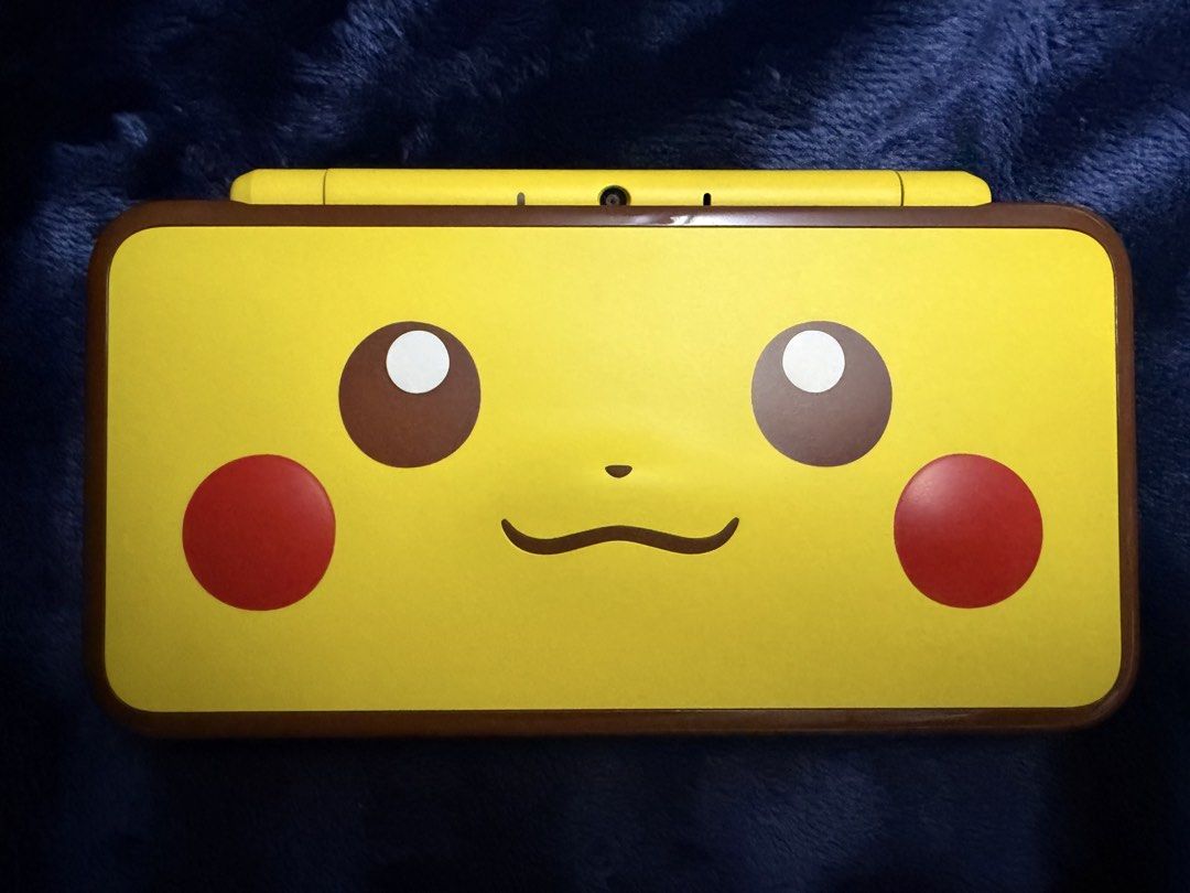 RARE Pokémon New Nintendo 2DS XL Pikachu Edition - Complete Boxed Bundle (Category: Nintendo) located in Manila. Submitted by aybi.7.3.1 (Listing ID 1468311701, Image 2). Description: COLLECTOR’S ITEM: Authentic, highly collectible New Nintendo 2DS XL Pikachu Edition complete with its original box! It features Pikachu’s iconic raised, textured nose and cheeks on the top shell—a must-have centerpiece for any Pokémon fan or handheld collector. The 