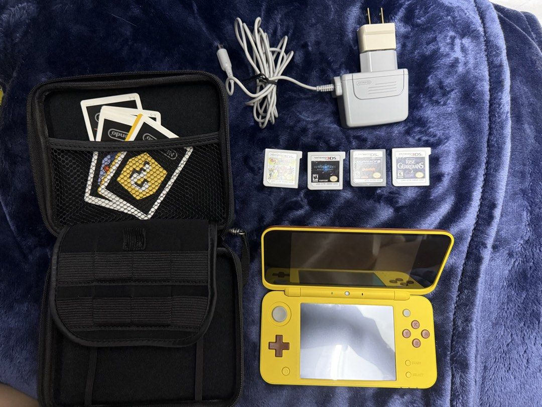 RARE Pokémon New Nintendo 2DS XL Pikachu Edition - Complete Boxed Bundle (Category: Nintendo) located in Manila. Submitted by aybi.7.3.1 (Listing ID 1468311701, Image 1). Description: COLLECTOR’S ITEM: Authentic, highly collectible New Nintendo 2DS XL Pikachu Edition complete with its original box! It features Pikachu’s iconic raised, textured nose and cheeks on the top shell—a must-have centerpiece for any Pokémon fan or handheld collector. The 
