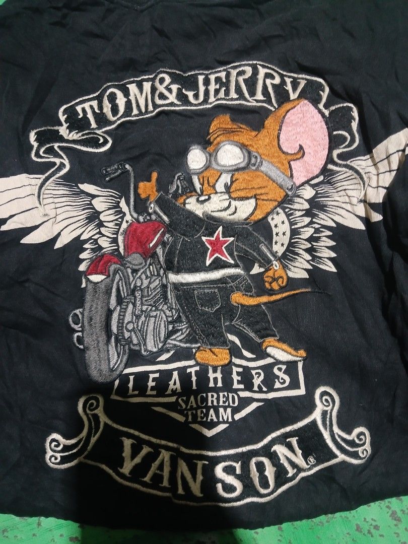 Rare vanson x tom and jerry (Category: Tshirts & Polo Shirts ) located in San Jose. Submitted by garments17 (Listing ID 1468386267, Image 1). Description: - Color: Black - Design: Large embroidered Tom and Jerry on a motorcycle with Vanson Leathers branding and white wings framing - Details: Heavy embroidery work on the chest, classic biker theme mashup - Material: Comfortable, high-quality fabric - Condition: Great piece for collectors and stree