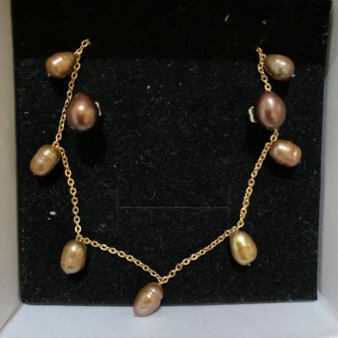 Real freshwater Brown pearl Set (Category: Necklaces) located in Quezon City. Submitted by itscxyy (Listing ID 1468070386, Image 2). Description: - Stainless steel gold-tone necklace and stud earrings - Accented with evenly spaced real freshwater brown pearls necklace paired with stud earrings - Dainty style, perfect for everyday wear or layering.
