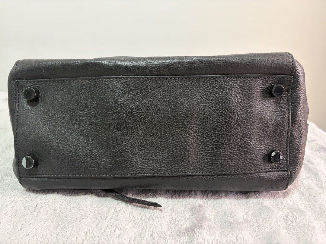 <Pre-loved> Rebecca Minkoff Black Large Structured Leather Tote Bag with Front Pocket (Category: Tote Bags) located in Malolos. Submitted by rainbow.06 (Listing ID 1468303687, Image 3). Description: - Material: Premium black structured leather with textured front pocket detail (repainted from b&w stripes to pure black) - Closure: Smooth main top zipper - Storage: Roomy interior with slip pockets and front exterior flap pocket - Details: Double to
