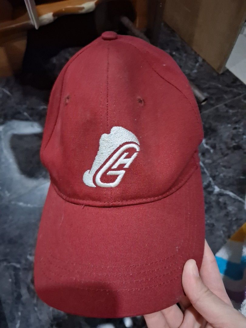 Red baseball cap with embroidered logo (Category: Caps & Hats) located in Manila. Submitted by brightpenguin_a65122 (Listing ID 1468410396, Image 1). Description: - Color: Red with white embroidered graphic on the front - Material: 100% cotton, standard fit - Features: Classic curved brim and adjustable strap at the back - Condition: Normal signs of wear - Fast deal preferred, grab it quick!.