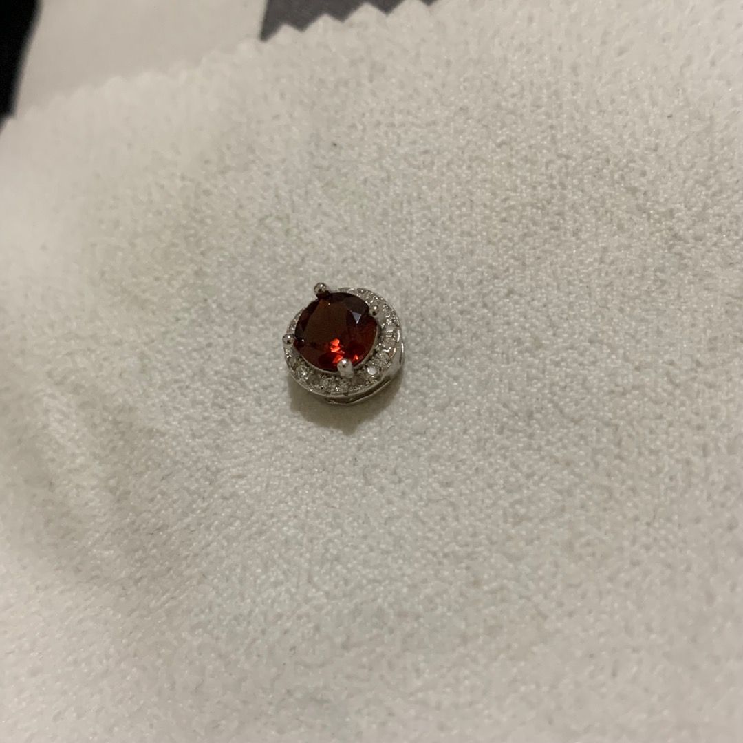 Round-cut Red Garnet pendant with Certificate (Category: Necklaces) located in Quezon City. Submitted by itscxyy (Listing ID 1468343279, Image 2). Description: - With gemstone certificate - Design: Round deep red garnet stone with a sparkling clear crystal halo - Setting: Silver-tone metal with secure prong setting - Note: Pendant only, no chain included.