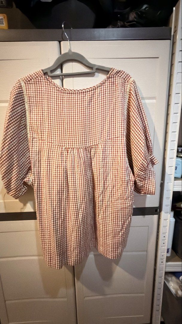 Red Gingham Checkered Short Sleeve Blouse With Lace Trim (Category: Blouses) located in Manila. Submitted by adoptmypreloveditems (Listing ID 1468476591, Image 1). Description: - Color/Pattern: Red and white gingham checkered - Sleeves: Short sleeves with ruffled cuffs - Details: Delicate white lace trim on front and back yoke seams, gathered pleats for a flowy fit - Neckline: Classic round neckline - Material: Lightweight and breathable, ideal f