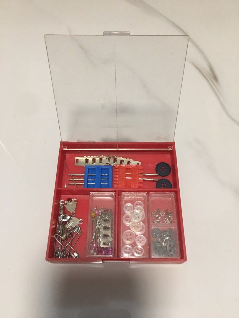 Red Plastic Mini Sewing Kit Box with Notions (Category: Craft Supplies & Tools) located in Pasay City. Submitted by gilbertso62551 (Listing ID 1468392314, Image 2). Description: - Compact red storage box for all your quick sewing and repair needs - Includes assorted pins, safety pins, needles, clear buttons, dark buttons, snap fasteners, and metal fasteners - Organized separate compartments with transparent lids to easily find what you need - Sec