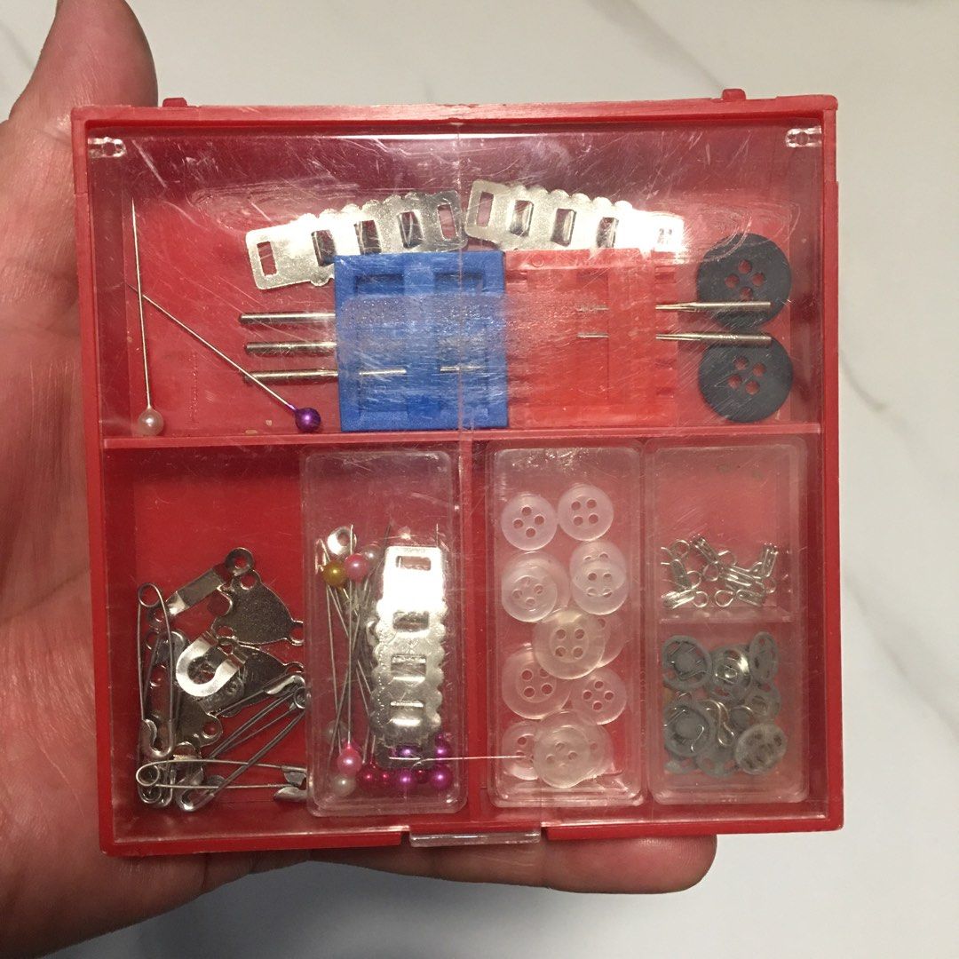 Red Plastic Mini Sewing Kit Box with Notions (Category: Craft Supplies & Tools) located in Pasay City. Submitted by gilbertso62551 (Listing ID 1468392314, Image 3). Description: - Compact red storage box for all your quick sewing and repair needs - Includes assorted pins, safety pins, needles, clear buttons, dark buttons, snap fasteners, and metal fasteners - Organized separate compartments with transparent lids to easily find what you need - Sec