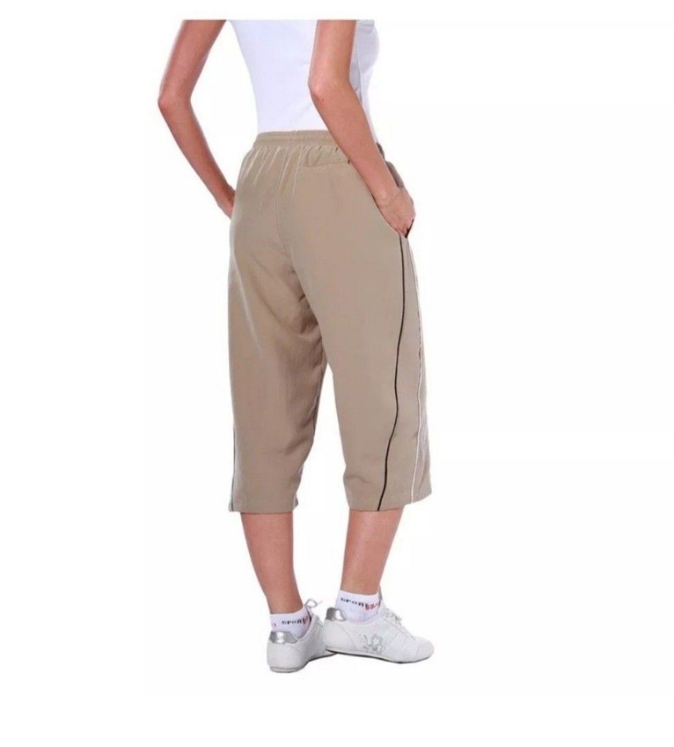 Reebok Capri Track Pants Beige (Category: Other Bottoms) located in Manila. Submitted by crejzshoppe (Listing ID 1468323443, Image 2). Description: New Authentic Reebok Capri Pants Short XS-S. Size on Tag is XS but can fit Small Size Authentic Reebok New with Tag On hand. ready to ship - Brand: Reebok - Style: Beige capri track pants (knee-length) - Material: Lightweight nylon, perfect for workouts or lounging - Features: Elastic waistband with d