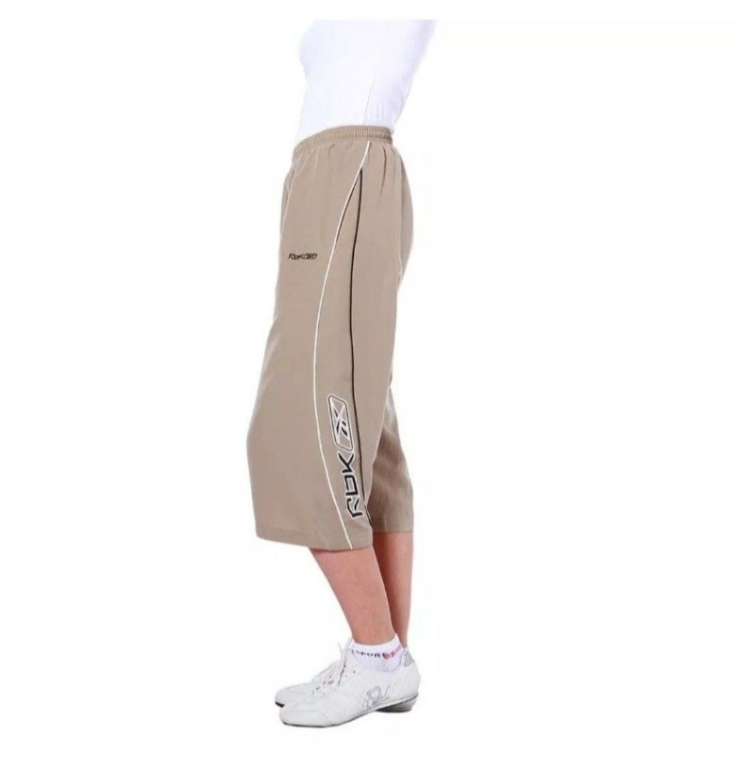 Reebok Capri Track Pants Beige (Category: Other Bottoms) located in Manila. Submitted by crejzshoppe (Listing ID 1468323443, Image 3). Description: New Authentic Reebok Capri Pants Short XS-S. Size on Tag is XS but can fit Small Size Authentic Reebok New with Tag On hand. ready to ship - Brand: Reebok - Style: Beige capri track pants (knee-length) - Material: Lightweight nylon, perfect for workouts or lounging - Features: Elastic waistband with d