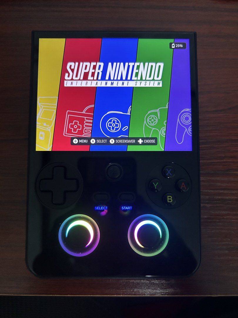 Anbernic r477v Base Model (Category: Nintendo) located in Manila. Submitted by gamesstranded (Listing ID 1468388798, Image 1). Description: - Portable retro gaming handheld, perfect for playing SNES and classic systems on the go - Sleek vertical form factor with a bright, clear display - Equipped with a responsive D-pad, face buttons, and dual glowing RGB thumbsticks - Stylish blue-glowing Select and Start buttons - Compact and lightweight design