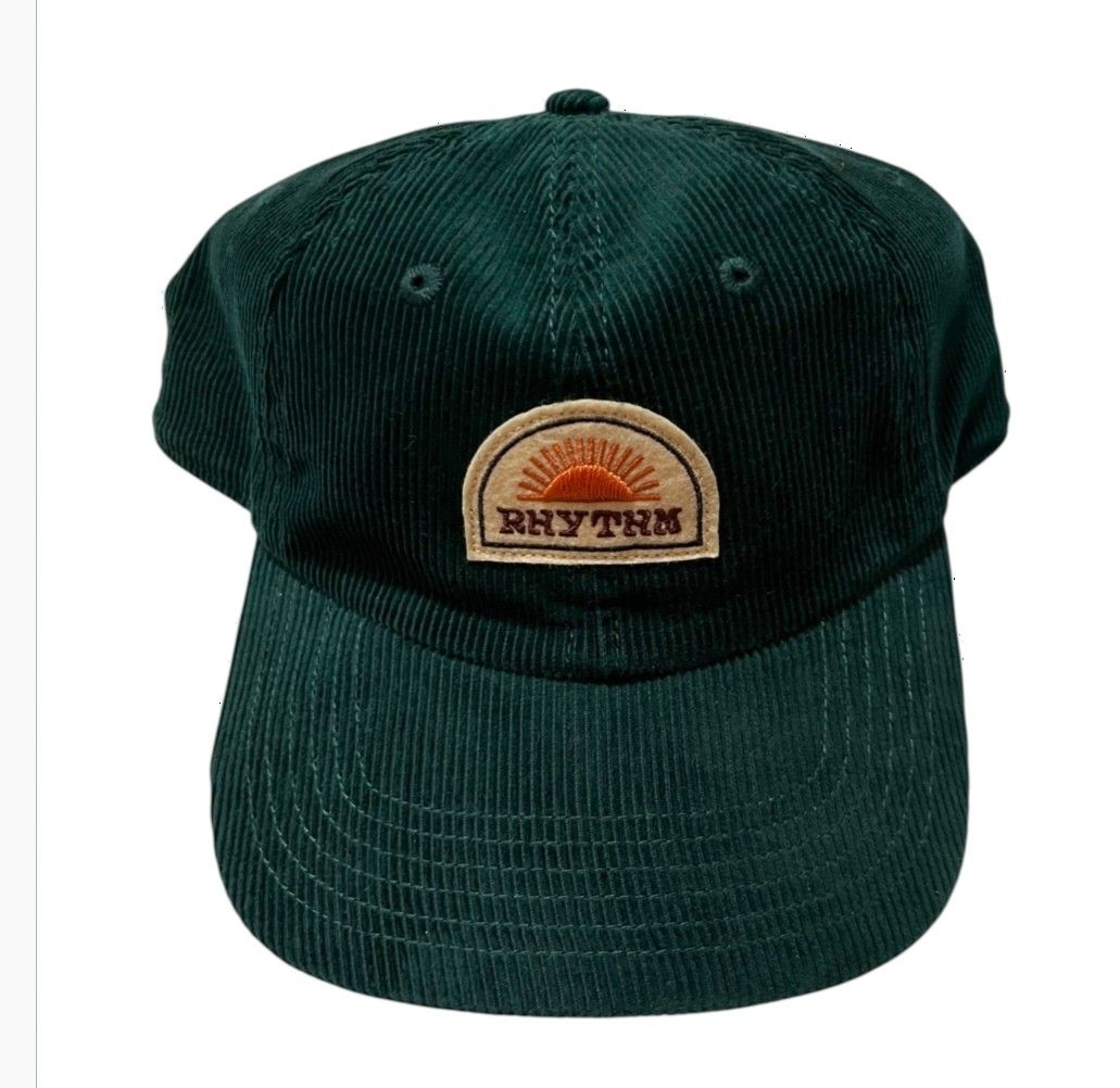 Rhythm Green Corduroy Baseball Cap with Sunrise Patch (Category: Caps & Hats) located in Cagayan de Oro. Submitted by lootfindzzzz (Listing ID 1468354804, Image 1). Description: - Brand: Rhythm - Material: Deep forest green corduroy wale fabric - Design: Classic six-panel construction with curved brim - Detail: Stitched semicircular patch featuring a sunrise graphic and Rhythm lettering - Fit: Adjustable strap at the back for a custom fit.