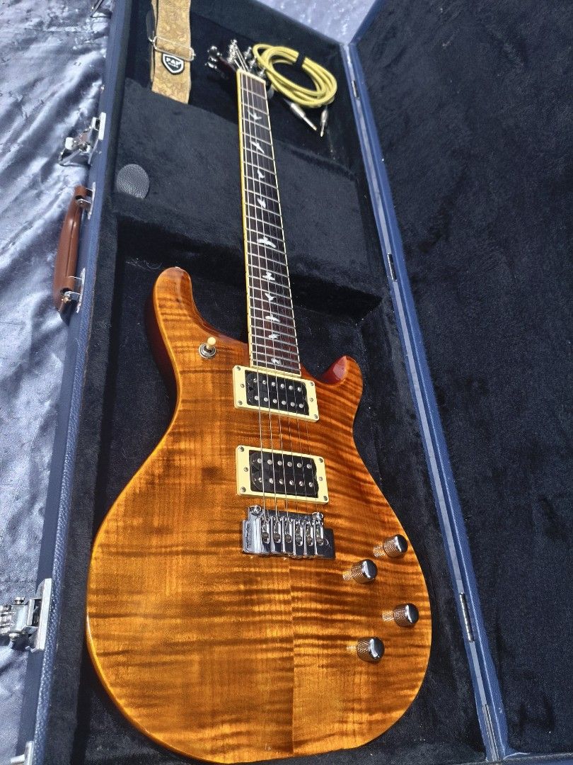 RJ Tonemaster Deluxe Plus (PRS Style with Flame Maple Top) (Category: Musical Instruments) located in Caloocan City. Submitted by juzztine22 (Listing ID 1468293346, Image 1). Description: Selling my RJ Tonemaster Deluxe Plus electric guitar. inspired by a PRS design, featuring beautiful bird fretboard inlays and flame maple top finish. with split coil for strat and les paul tone for versatile player. very well maintained and kept clean. Set up by
