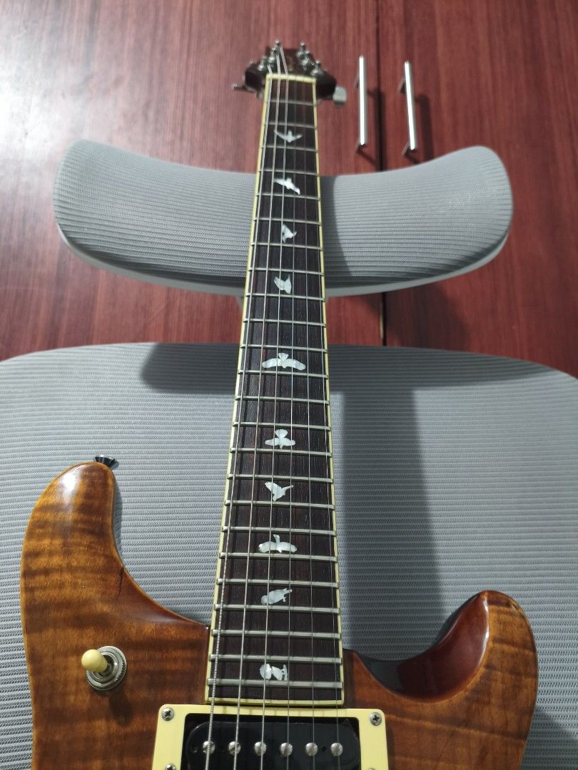 RJ Tonemaster Deluxe Plus (PRS Style with Flame Maple Top) (Category: Musical Instruments) located in Caloocan City. Submitted by juzztine22 (Listing ID 1468293346, Image 3). Description: Selling my RJ Tonemaster Deluxe Plus electric guitar. inspired by a PRS design, featuring beautiful bird fretboard inlays and flame maple top finish. with split coil for strat and les paul tone for versatile player. very well maintained and kept clean. Set up by