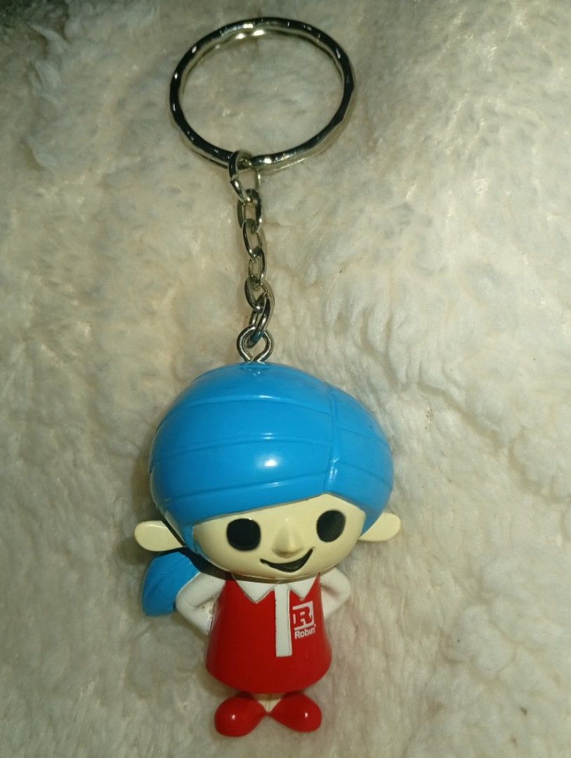 Robin with his 100 Friends" Mascot Figure Keyring (Category: Trading Cards Accessories) located in Tarlac. Submitted by kaizer_rabbit (Listing ID 1468307054, Image 1). Description: Robin with his 100 Friends" Mascot Figure Keyring (specifically featuring the female mascot character wrapped in a blue turban/hijab) [1, 2] Brand: Robin (a popular household consumer brand in Asian and Middle Eastern markets, widely known for products like Robin Blue 