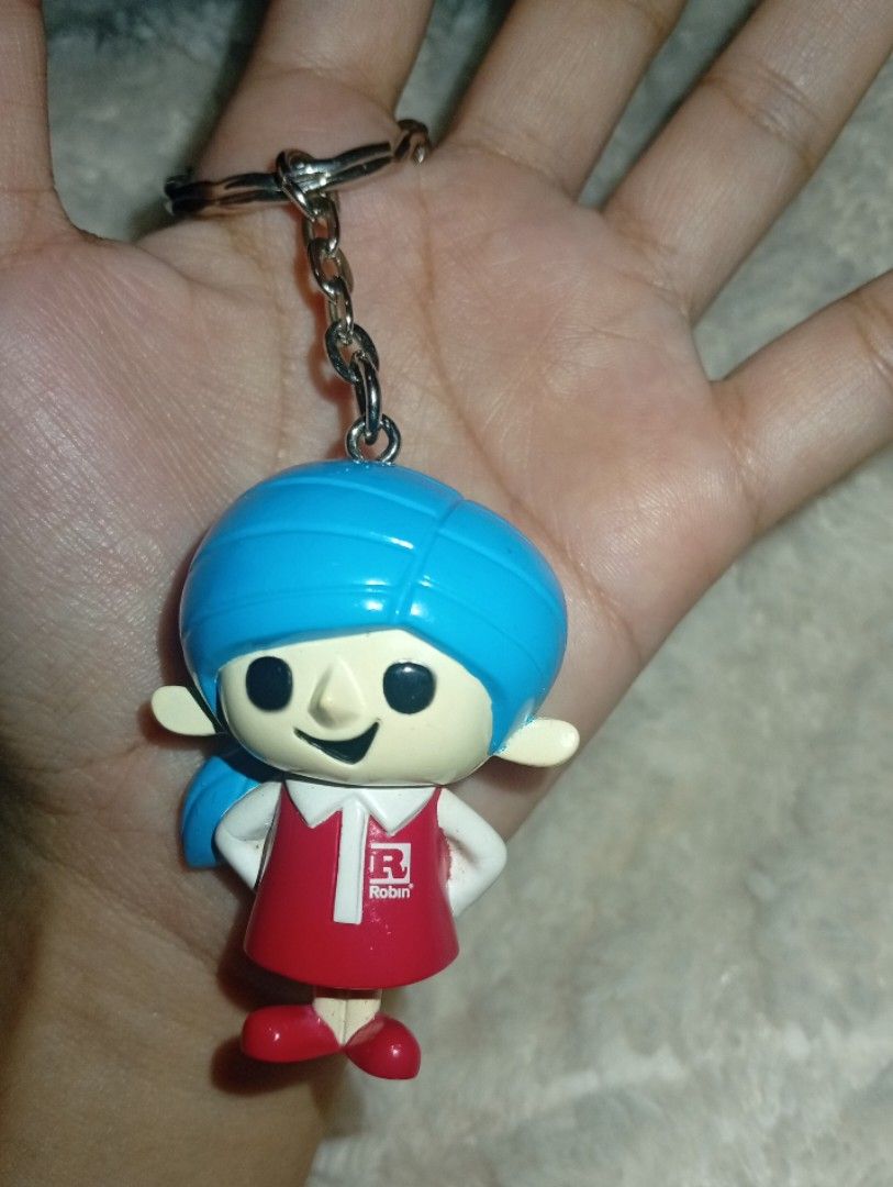 Robin with his 100 Friends" Mascot Figure Keyring (Category: Trading Cards Accessories) located in Tarlac. Submitted by kaizer_rabbit (Listing ID 1468307054, Image 2). Description: Robin with his 100 Friends" Mascot Figure Keyring (specifically featuring the female mascot character wrapped in a blue turban/hijab) [1, 2] Brand: Robin (a popular household consumer brand in Asian and Middle Eastern markets, widely known for products like Robin Blue 