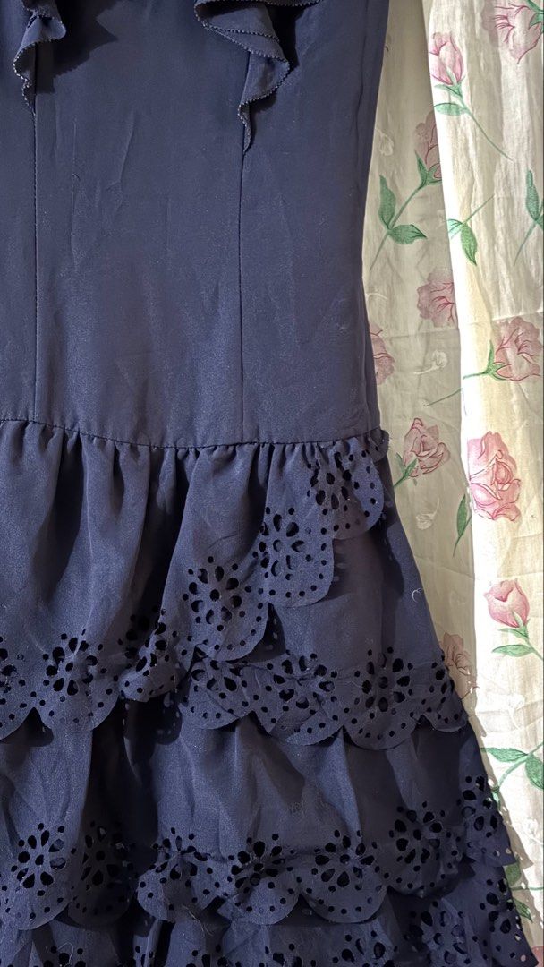Roem Navy Blue Ruffle Eyelet bubble Dress (Category: Dresses) located in Calauan. Submitted by bellabells_thrifthings (Listing ID 1468430342, Image 3). Description: - Brand: Roem - Size: Small to Medium (S/M) - Color: Navy Blue - Design: Scoop neckline with layered shoulder ruffles - Waist: Dropped waist with multi-layered ruffled skirt - Details: Beautiful laser-cut eyelet embroidery - Closure: Back neck button closure - Condition: Has minimal f