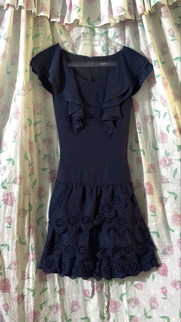 Roem Navy Blue Ruffle Eyelet bubble Dress (Category: Dresses) located in Calauan. Submitted by bellabells_thrifthings (Listing ID 1468430342, Image 1). Description: - Brand: Roem - Size: Small to Medium (S/M) - Color: Navy Blue - Design: Scoop neckline with layered shoulder ruffles - Waist: Dropped waist with multi-layered ruffled skirt - Details: Beautiful laser-cut eyelet embroidery - Closure: Back neck button closure - Condition: Has minimal f