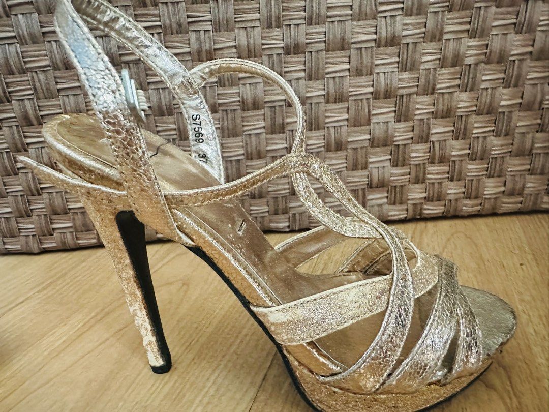 Rose Gold High Heel Platform Sandals Size 37 (Category: Heels) located in Makati City. Submitted by good_deals2026 (Listing ID 1468318291, Image 3). Description: - Item: Gold strappy platform stiletto heels - Limited edition - Size: 37 - Design: Metallic finish, multi-strap cutout front, and adjustable ankle buckle closure - Comfort: Platform sole under the toe area for extra height and stability - Condition: Moderate wear on the inner soles and 