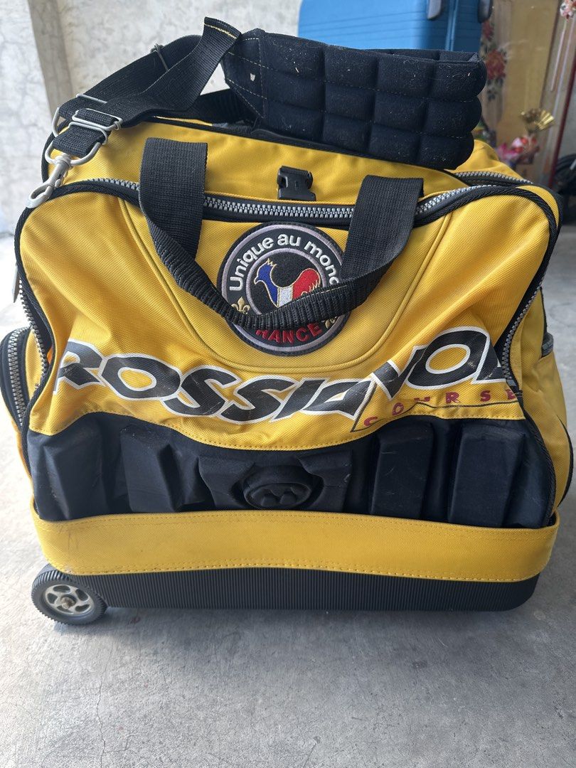 Rossignol Course Yellow Rolling Duffle Travel Bag (Category: Backpacks) located in Cainta. Submitted by shopbyyna (Listing ID 1468310620, Image 1). Description: - Authentic Rossignol Course rolling duffel bag in striking yellow and black - Equipped with sturdy wheels and a convenient retractable handle setup - Built with heavy-duty zippers for maximum durability - Dual carry straps plus a comfortable padded shoulder strap - Features unique embroi