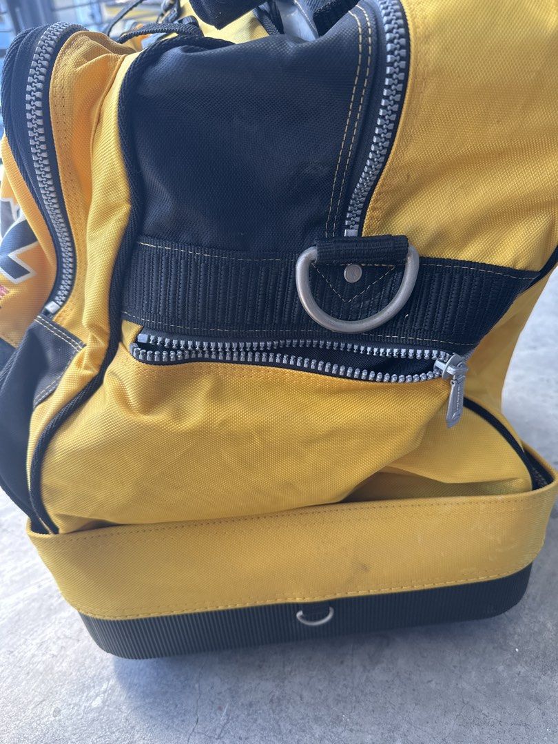 Rossignol Course Yellow Rolling Duffle Travel Bag (Category: Backpacks) located in Cainta. Submitted by shopbyyna (Listing ID 1468310620, Image 2). Description: - Authentic Rossignol Course rolling duffel bag in striking yellow and black - Equipped with sturdy wheels and a convenient retractable handle setup - Built with heavy-duty zippers for maximum durability - Dual carry straps plus a comfortable padded shoulder strap - Features unique embroi
