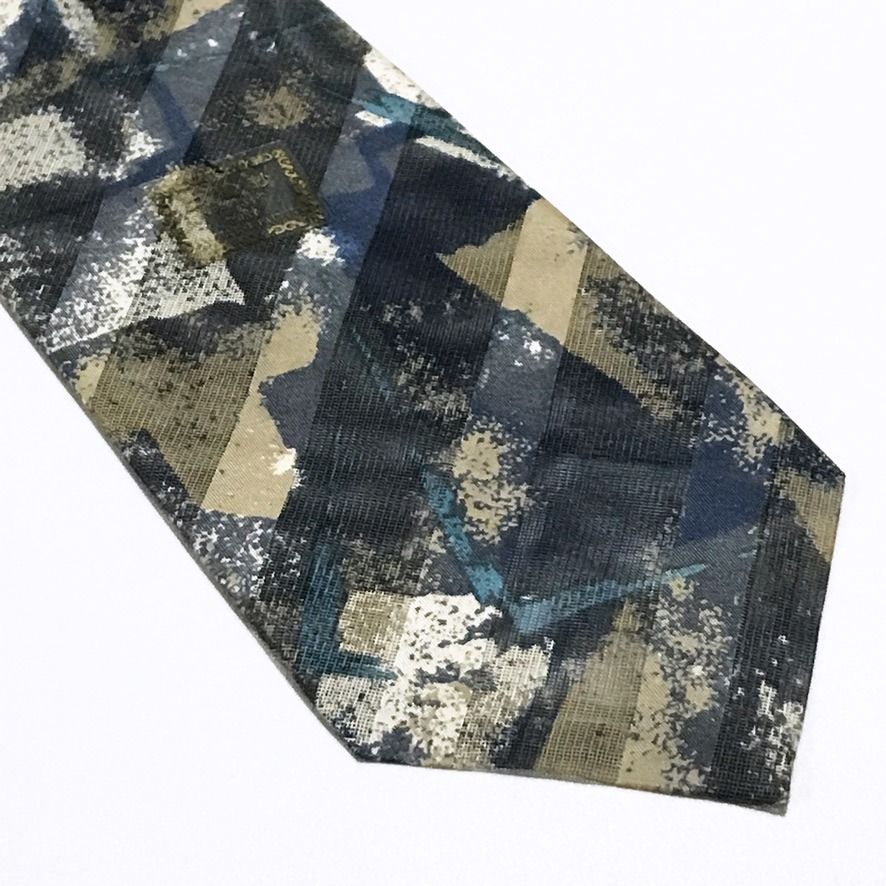 Ruffeno NWT Abstract Pattern Textured Sheer Fabric Neck Tie (Category: Ties) located in Taguig. Submitted by retrogaze (Listing ID 1468313187, Image 2). Description: This 100% silk necktie by Ruffeno features a light-catching, sheer net-like mesh weave overlaid with a multi-textured abstract geometric pattern. The blade showcases dynamic, painterly diagonal brushstrokes and speckled textures in muted tones of slate blue, khaki tan, charcoal grey,