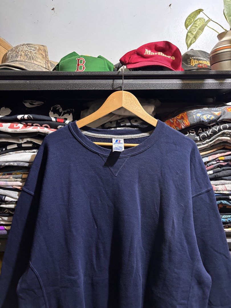 Russell Athletic Navy Blue Sweatshirt XL (Category: Coats, Jackets and Outerwear) located in General Santos City (Dadiangas). Submitted by andrei_ciocon (Listing ID 1468376412, Image 2). Description: - Brand: Russell Athletic - Dimes: 26w / 29l - Color: Solid Navy Blue - Size: XL - Material: 50% Cotton, 50% Polyester (Soft fleece interior) - Features: Classic crewneck, signature 'V' stitch at collar, ribbed side panels, and logo tag on left cuff 