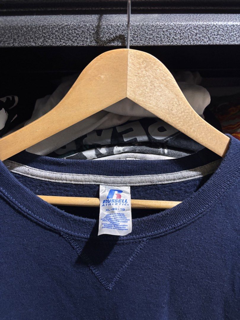 Russell Athletic Navy Blue Sweatshirt XL (Category: Coats, Jackets and Outerwear) located in General Santos City (Dadiangas). Submitted by andrei_ciocon (Listing ID 1468376412, Image 3). Description: - Brand: Russell Athletic - Dimes: 26w / 29l - Color: Solid Navy Blue - Size: XL - Material: 50% Cotton, 50% Polyester (Soft fleece interior) - Features: Classic crewneck, signature 'V' stitch at collar, ribbed side panels, and logo tag on left cuff 