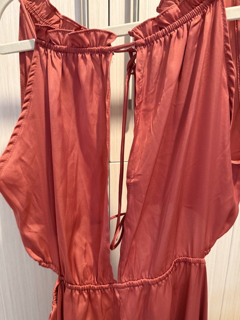 Rust Orange Halter Maxi Dress (Category: Dresses) located in Cebu City. Submitted by onlineclosetbypat (Listing ID 1468285030, Image 2). Description: - Color: Rust orange - Size: S - Material: Lightweight satin-like fabric - Design: Halter neck with ruffled collar trim - Details: Deep front split with tie accents at neckline and waist - Fit: Elasticated waistband for a comfortable fit - Condition: Brand new / Excellent.