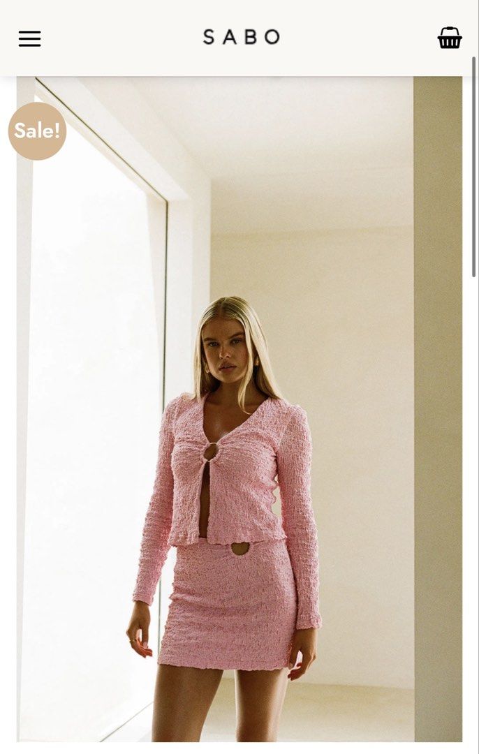 SABO Skirt Pink Textured Ring Two Piece Set Size M (Category: Sets or Coordinates) located in Quezon City. Submitted by mikaela_0 (Listing ID 1468354468, Image 2). Description: - Brand: SABO Skirt - Style: Pink two-piece set with long sleeve top and matching mini skirt - Material: Textured crinkle fabric - Details: Gold ring front closure on top, waist cutout with matching ring hardware on skirt - Size: both M (AU 10, US 6), fits small to medium 