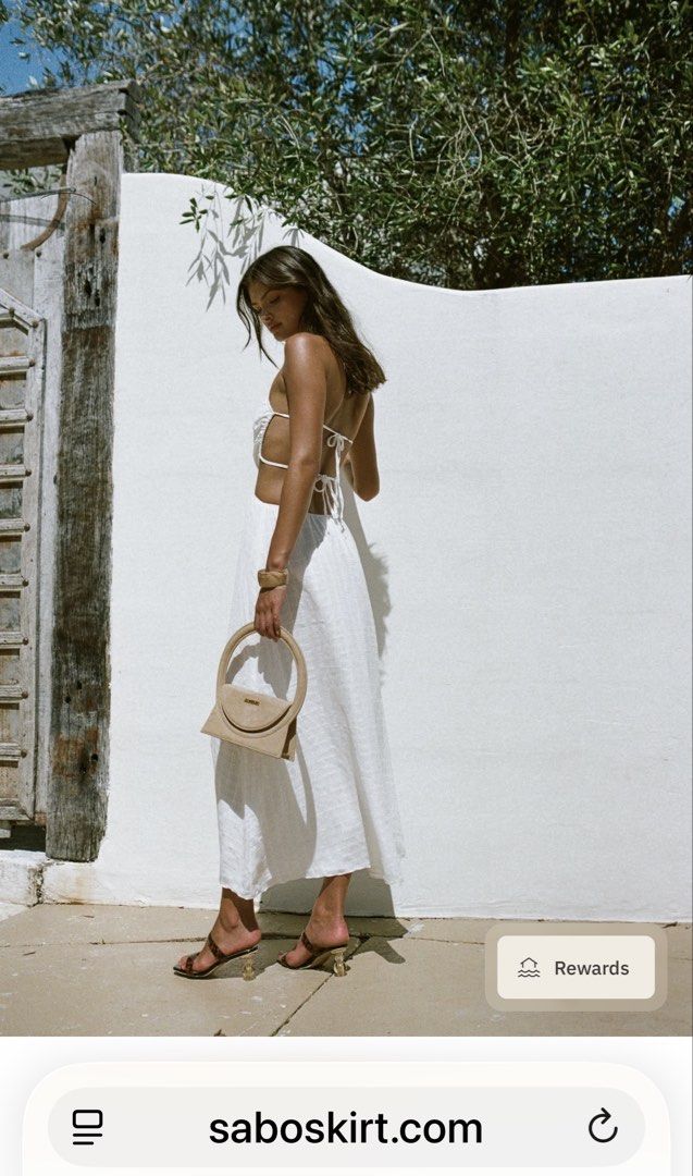 Sabo White Cutout Halter Maxi Dress (Category: Dresses) located in Quezon City. Submitted by mikaela_0 (Listing ID 1468352568, Image 2). Description: Sabo Skirt white halter maxi dress, cutout sides, front knot, and open back Brand new with tag Never worn Size medium, can fit small-medium.