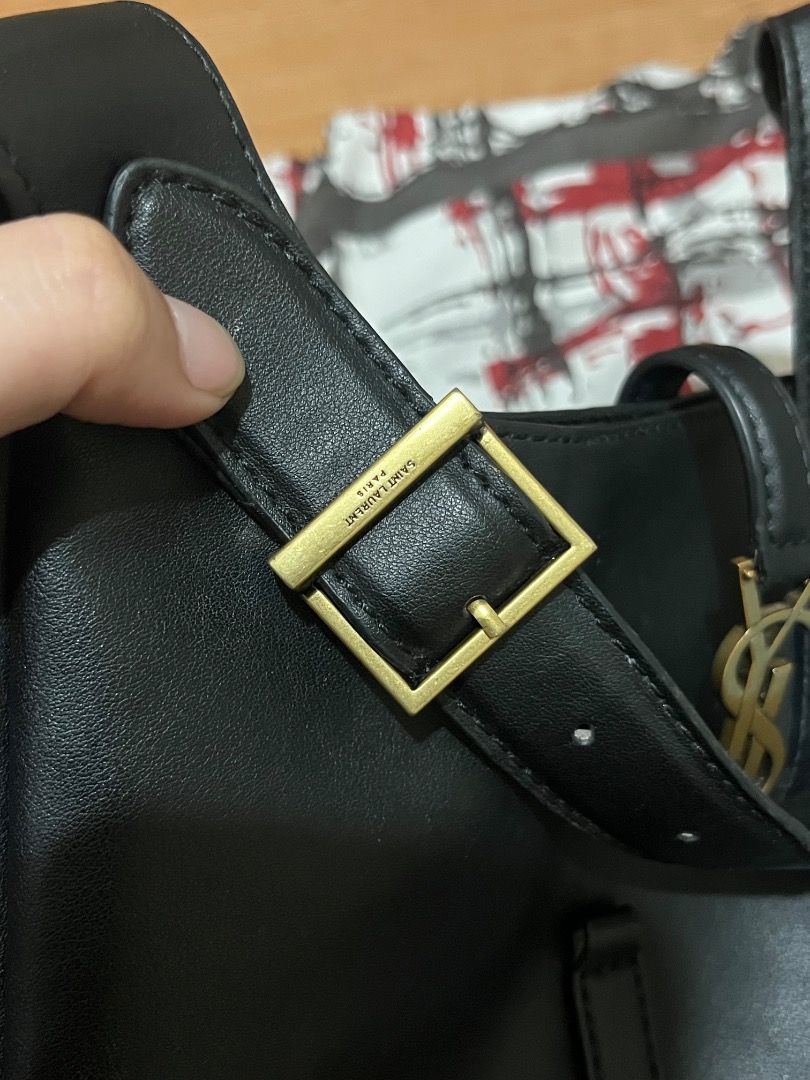 Saint Laurent Black Leather Hobo Bag (Category: Luxury Bags & Wallets) located in Rosario. Submitted by namayang_ (Listing ID 1468433074, Image 3). Description: - Brand: Saint Laurent (YSL) - Style: Hobo Bag - Material: Premium Black Leather - Hardware: Gold-tone with iconic YSL monogram - Strap: Adjustable shoulder strap with YSL stamped gold buckle - Interior: Includes zippered pocket and Saint Laurent leather brand tag - Origin: Made in Italy 