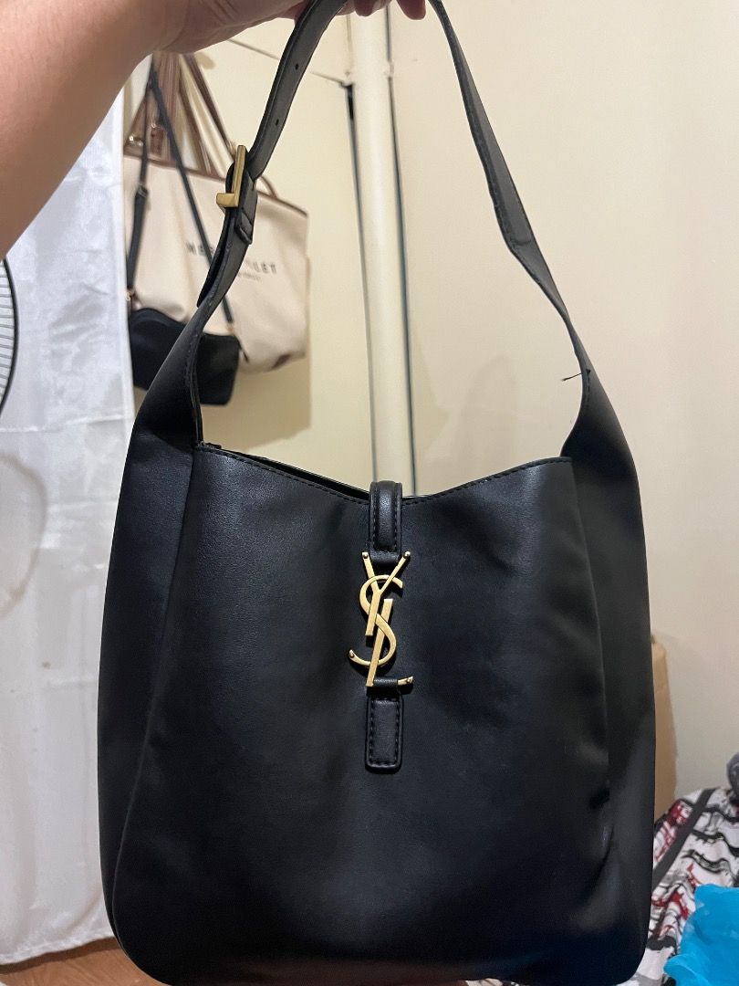 Saint Laurent Black Leather Hobo Bag (Category: Luxury Bags & Wallets) located in Rosario. Submitted by namayang_ (Listing ID 1468433074, Image 1). Description: - Brand: Saint Laurent (YSL) - Style: Hobo Bag - Material: Premium Black Leather - Hardware: Gold-tone with iconic YSL monogram - Strap: Adjustable shoulder strap with YSL stamped gold buckle - Interior: Includes zippered pocket and Saint Laurent leather brand tag - Origin: Made in Italy 