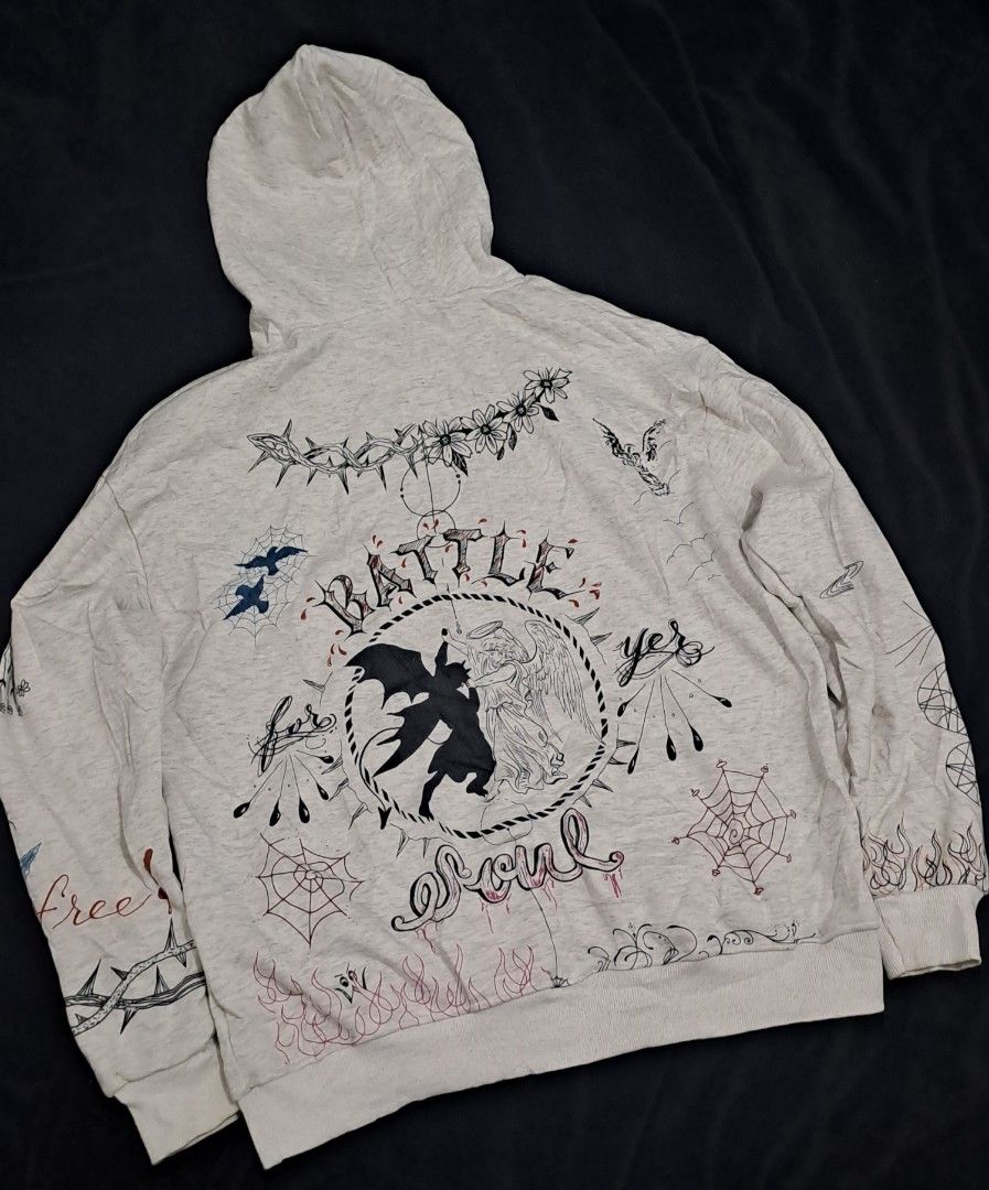 Saint Michael x Dr Woo Hoodie (Category: Hoodies) located in Puerto Princesa. Submitted by jercksthriftph (Listing ID 1468386713, Image 2). Description: Saint Michael x Dr Woo Hoodie , Size: XL 23 x 28 - Color: Heather grey - no tags / care tags - Design: All-over tattoo-style graphics with 'Heaven and Hell' and 'Battle For Your Soul' artwork - Details: Heavy prints on chest, back, and sleeves featuring angels, devils, and flames - Features: Comf