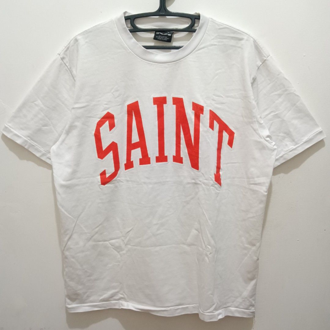 SAINT Spell Out Shirt (Category: Shirts) located in Caloocan City. Submitted by jaychingsss (Listing ID 1468398645, Image 1). Description: Saint Spell Out Shirt - 180 22x27 Makapal Tela Single Stitch Minor issue: may isang pinhole NEED WASH.