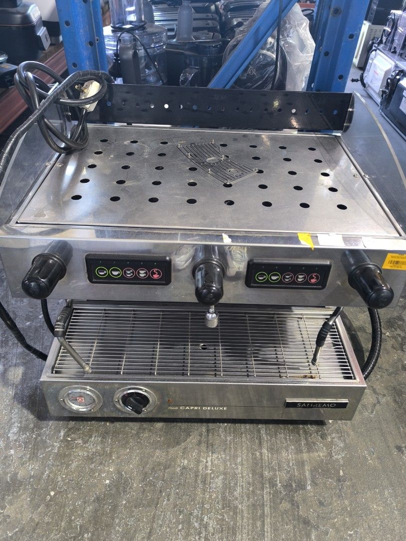 Sanremo Capri Deluxe Commercial Espresso Machine (Category: Coffee Machines & Makers) located in Dasmarinas. Submitted by bossgabo (Listing ID 1468286536, Image 2). Description: - Brand/Model: Sanremo Capri Deluxe - Setup: Dual group commercial espresso machine - Finish: Durable stainless steel - Features: Push-button controls per side, steam wands, hot water tap, pressure gauge, and top cup warming tray.