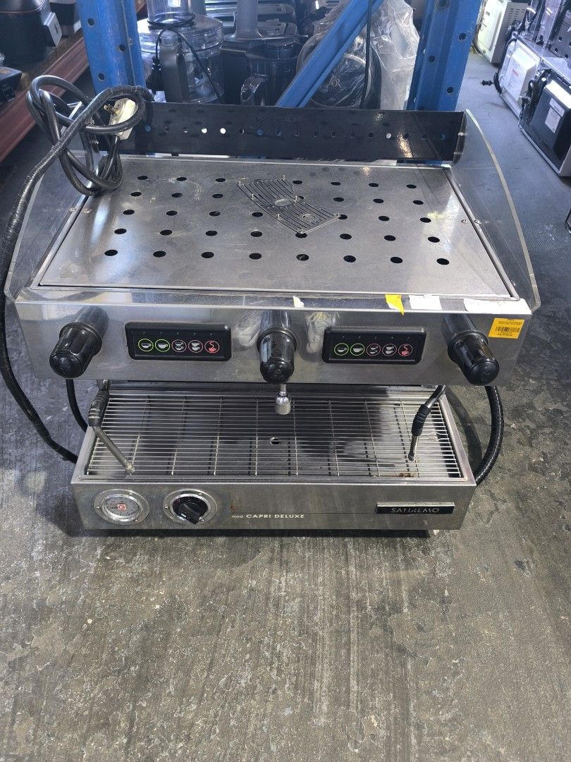 Sanremo Capri Deluxe Commercial Espresso Machine (Category: Coffee Machines & Makers) located in Dasmarinas. Submitted by bossgabo (Listing ID 1468286536, Image 3). Description: - Brand/Model: Sanremo Capri Deluxe - Setup: Dual group commercial espresso machine - Finish: Durable stainless steel - Features: Push-button controls per side, steam wands, hot water tap, pressure gauge, and top cup warming tray.