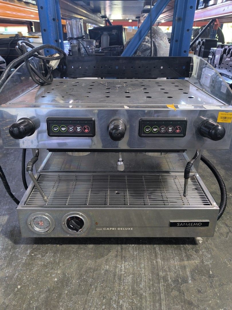 Sanremo Capri Deluxe Commercial Espresso Machine (Category: Coffee Machines & Makers) located in Dasmarinas. Submitted by bossgabo (Listing ID 1468286536, Image 1). Description: - Brand/Model: Sanremo Capri Deluxe - Setup: Dual group commercial espresso machine - Finish: Durable stainless steel - Features: Push-button controls per side, steam wands, hot water tap, pressure gauge, and top cup warming tray.