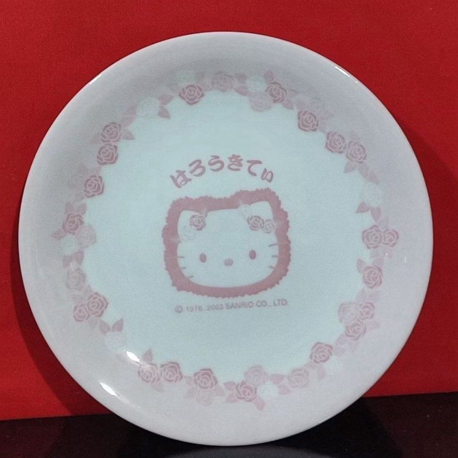 Sanrio Hello Kitty 2003 Rose Floral Ceramic Plate Set (Category: Dinnerware & Cutlery) located in Manila. Submitted by janetecson05 (Listing ID 1468301969, Image 1). Description: - Authentic 2003 Sanrio Kitty ceramic plates (Pair) - Design: Classic white finish with a charming pink rose border - Features: Center Kitty graphic with Japanese text and copyright stamp - Size: Standard dinner plate size - Finish: Smooth glossy glaze with a plain white