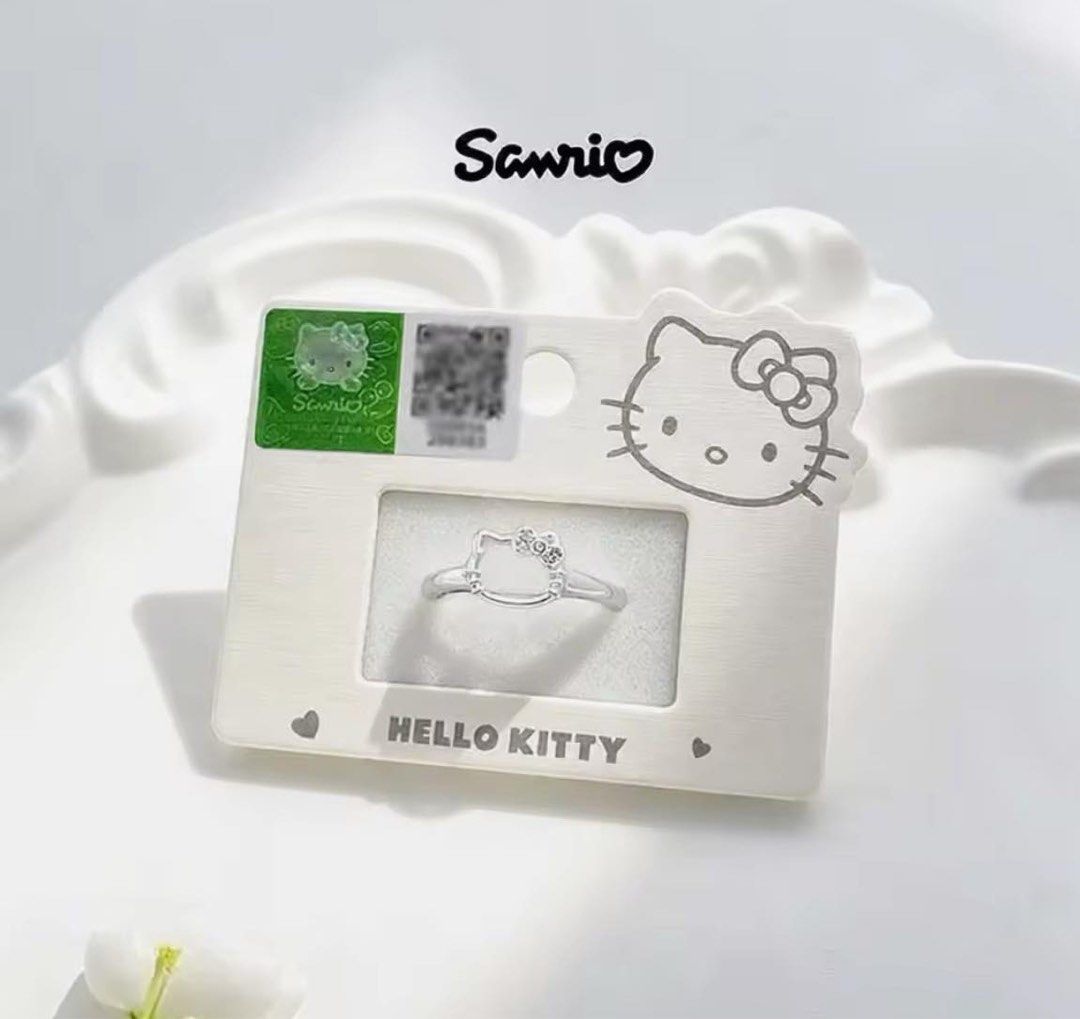 Sanrio Hello Kitty Silver Ring Official Merchandise (Category: Rings) located in Manila. Submitted by janetecson05 (Listing ID 1468297941, Image 1). Description: - Authentic Sanrio Kitty silver ring - Features a cute Kitty face outline with a sparkly bow detail - Brand new and unused - Comes mounted on original Sanrio branded card backing with authenticity sticker intact - Perfect gift or accessory for Kitty fans.