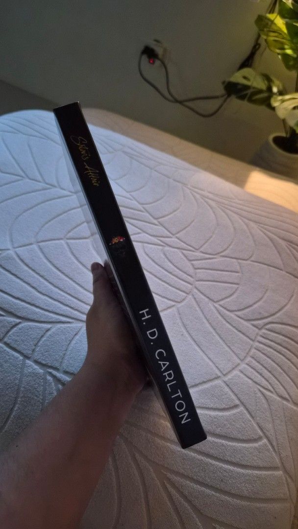 Satan's Affair by H.D. Carlton (Category: Storybooks) located in Mabalacat. Submitted by anjericaaa (Listing ID 1468331041, Image 2). Description: - Title: Satan's Affair by H.D. Carlton - Format: Hardcover with striking illustrated cover - Condition: Great, clean pages, solid spine. - Genre: Dark romance and thriller fiction - Perfect addition to any dark romance bookshelf.