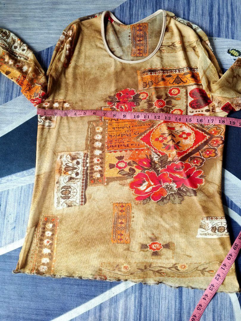 Save the Queen (Category: Longsleeves) located in Manila. Submitted by icamalicdem29 (Listing ID 1468386851, Image 3). Description: Save the Queen! sheer mesh long-sleeve top featuring an ornate, warm-toned earth graphic print. The Italian brand Save the Queen! is highly sought after for its iconic Y2K avant-garde, whimsigoth, and patchwork-style designs. cut tag.