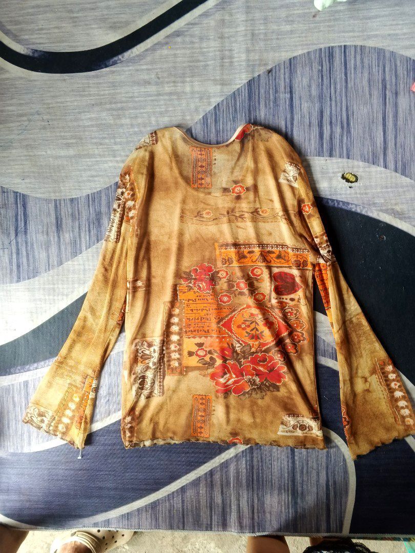 Save the Queen (Category: Longsleeves) located in Manila. Submitted by icamalicdem29 (Listing ID 1468386851, Image 1). Description: Save the Queen! sheer mesh long-sleeve top featuring an ornate, warm-toned earth graphic print. The Italian brand Save the Queen! is highly sought after for its iconic Y2K avant-garde, whimsigoth, and patchwork-style designs. cut tag.