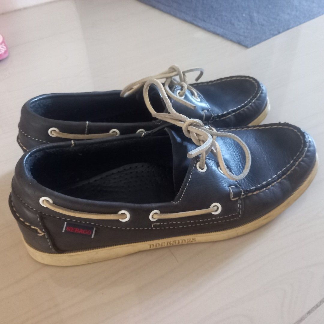 Sebago Docksides Leather Boat Shoes (Category: Casual Shoes) located in Baliuag. Submitted by happybday3 (Listing ID 1468318524, Image 2). Description: - Brand: Sebago Docksides - Color: navy - Material: Genuine leather upper - Style: Classic slip-on nautical boat shoes with white contrast stitching - Features: Signature red brand tag, non-marking rubber siped soles with excellent grip - Condition: Minimal wear on soles and uppers, well-maintaine