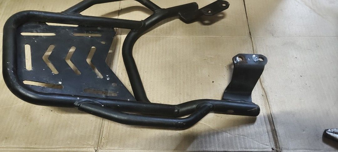 SEC Motorcycle Rear Top Box Rack Carrier (Category: Body Parts and Accessories) located in Manila. Submitted by roserallos42594 (Listing ID 1468341606, Image 3). Description: - Brand: SEC - Material: Heavy-duty tubular steel with sturdy mounting plate - Compatibility: Fits motorcycles with pre-drilled base brackets for straightforward installation - Features: Multiple cutouts and slots ideal for securing top boxes and cargo - Condition: Used with