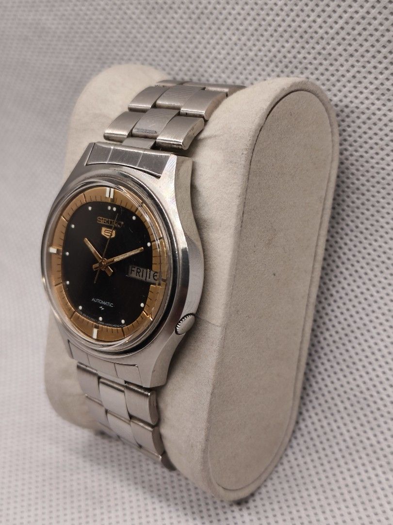 Seiko 5 Automatic watch 7009-8020 (Category: Men's Watches) located in Pasig City. Submitted by timepiece-and-co (Listing ID 1468401813, Image 2). Description: This is a vintage Seiko 5 Automatic watch. The specific reference and caliber number for this model variation (featuring the distinctive black center dial with a gold/tan outer ring) is the Seiko 7009-8020 (often also cataloged under related casing references like 7009-8023 or 7009-8028). 